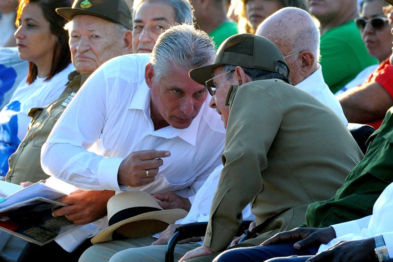 (FILE) Picture taken on on October 8, 2017 showing Cuban President Raul Castro (R) talking to First Vice President Miguel Diaz Canel (L), during the homage for the 50th anniversary of Ernesto 'Che' Guevara's death, in Santa Clara, Cuba.
Cuba is preparing for the end of an era next week when Raul Castro steps down as president, ending his family's six-decade grip on power, and paving the way for a younger leader. But analysts say his replacement, expected to be 57-year-old Miguel Diaz-Canel -- currently Cuba's first vice president -- won't quite be alone at the helm of the communist island. / AFP PHOTO / YAMIL LAGE / TO GO WITH AFP STORY by Alexandre GROSBOIS (Photo credit should read YAMIL LAGE/AFP/Getty Images)